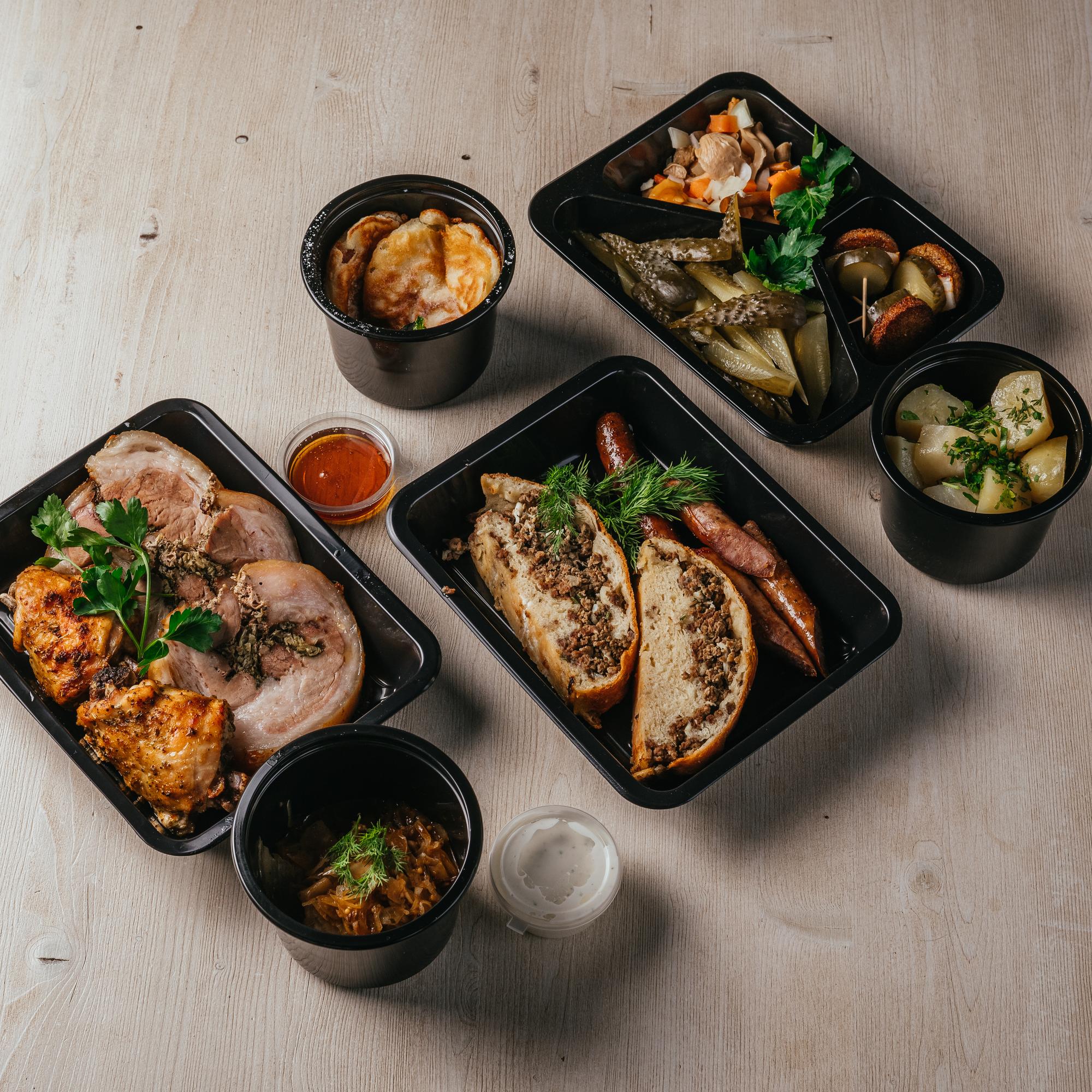 Tray of prepared gourmet meals ready for delivery